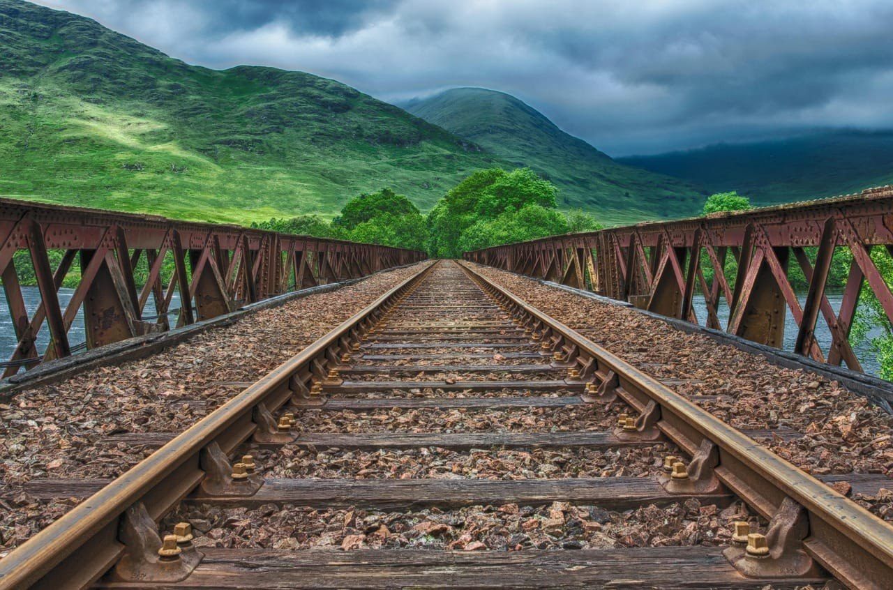 Railway track crossing a riveted steel bridge — ADKO supplies rolling stock to the Syrian Railways General Establishment